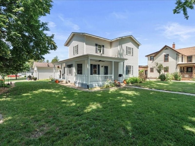433 S Iowa St, Solon, IA 52333 - view of front of property featuring covered porch, a ceiling fan, and a front yard