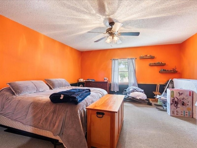 433 S Iowa St, Solon, IA 52333 - carpeted bedroom with a textured ceiling and ceiling fan