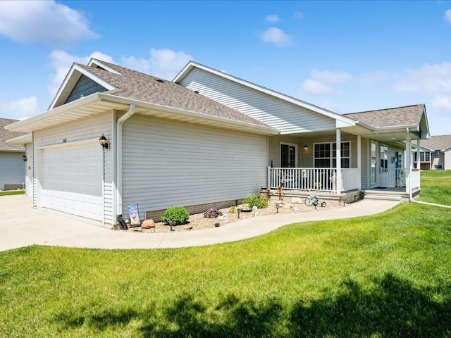 4408 Hastings Dr, Marion, IA 52302 - view of side of property featuring covered porch, a garage, a shingled roof, a yard, and concrete driveway