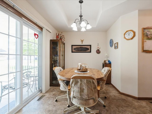 4408 Hastings Dr, Marion, IA 52302 - dining space featuring a chandelier, plenty of natural light, and a raised ceiling