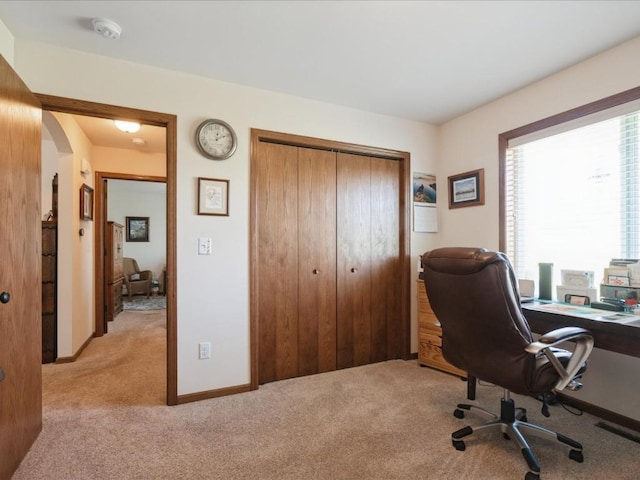 4408 Hastings Dr, Marion, IA 52302 - home office with light colored carpet and arched walkways
