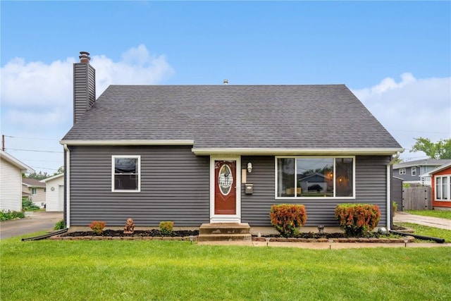 3007 Ravenwood Ter NW, Cedar Rapids, IA 52405 - view of front facade with a front lawn and a chimney