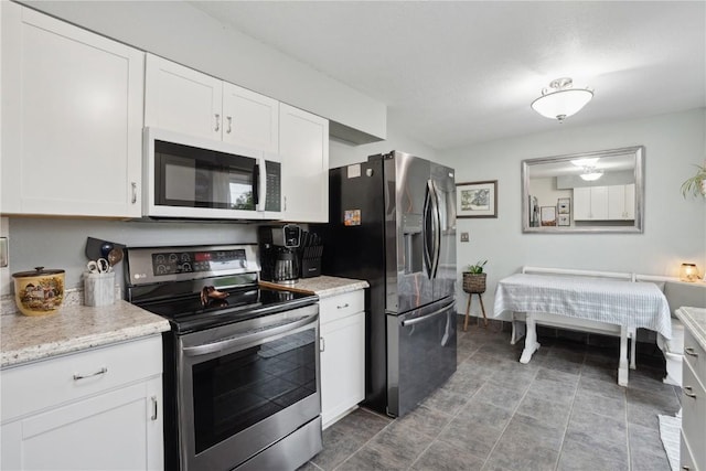 3007 Ravenwood Ter NW, Cedar Rapids, IA 52405 - kitchen featuring stainless steel appliances and white cabinets