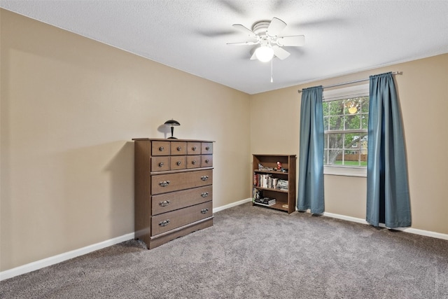 3051 Wayne Ave Unit 64, Iowa City, IA 52240 - bedroom with carpet, baseboards, a ceiling fan, and a textured ceiling