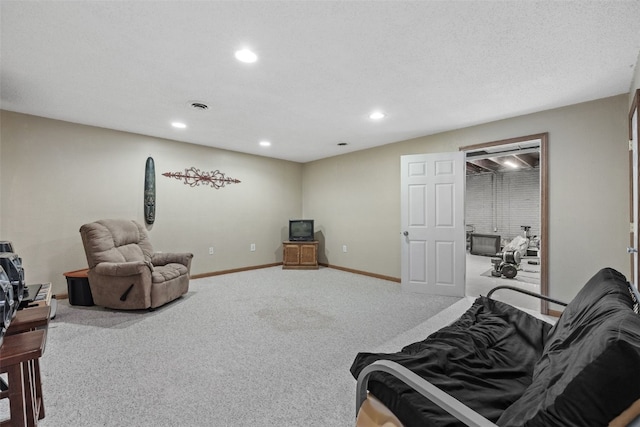 3051 Wayne Ave Unit 64, Iowa City, IA 52240 - carpeted living room with recessed lighting and baseboards