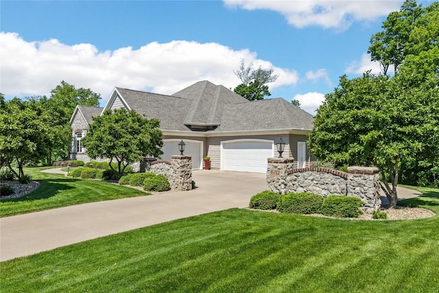 6712 Spring Grove Ct NE, Cedar Rapids, IA 52411 - view of front of house with an attached garage, a front yard, and concrete driveway