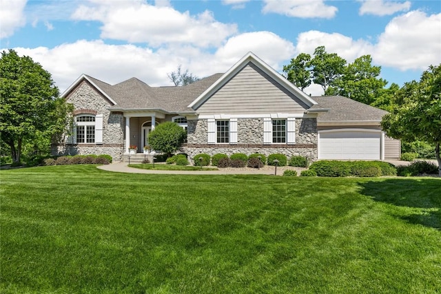 6712 Spring Grove Ct NE, Cedar Rapids, IA 52411 - view of front of house featuring stone siding, a front lawn, and a garage