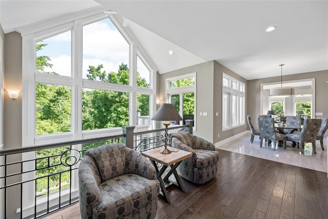 6712 Spring Grove Ct NE, Cedar Rapids, IA 52411 - living area with baseboards, vaulted ceiling, hardwood / wood-style flooring, and recessed lighting