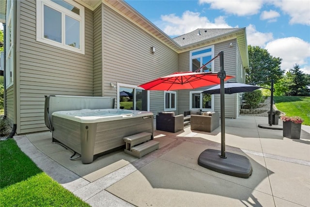 6712 Spring Grove Ct NE, Cedar Rapids, IA 52411 - view of patio / terrace with a hot tub and an outdoor living space