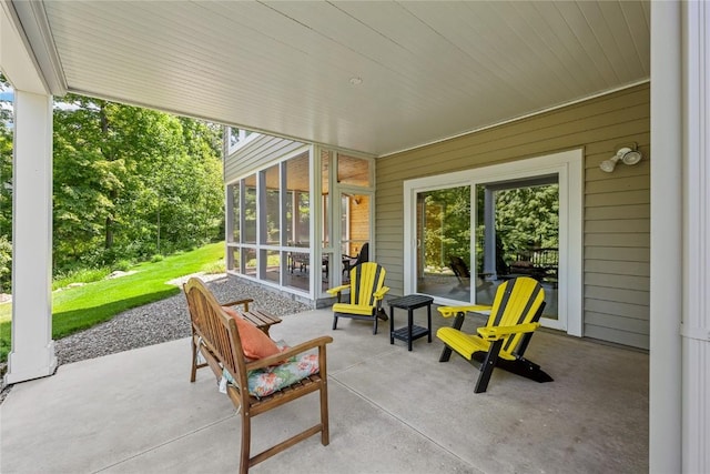 6712 Spring Grove Ct NE, Cedar Rapids, IA 52411 - view of patio / terrace with a sunroom