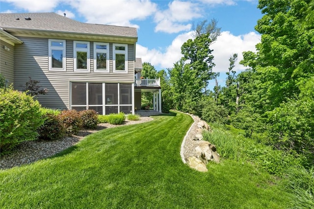 6712 Spring Grove Ct NE, Cedar Rapids, IA 52411 - rear view of property featuring a yard, a sunroom, and a balcony