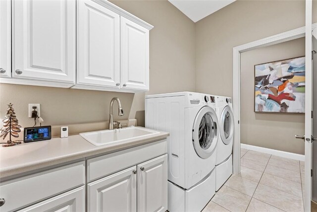 6712 Spring Grove Ct NE, Cedar Rapids, IA 52411 - laundry room with cabinet space, washer and dryer, light tile patterned floors, and baseboards