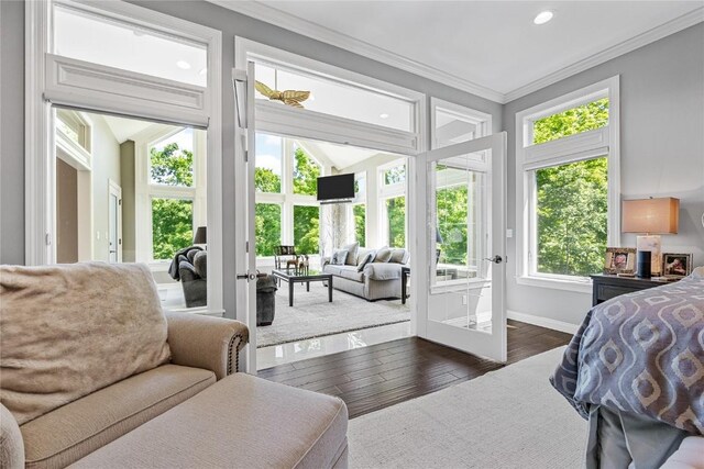 6712 Spring Grove Ct NE, Cedar Rapids, IA 52411 - bedroom featuring french doors, access to exterior, recessed lighting, crown molding, and dark wood-type flooring