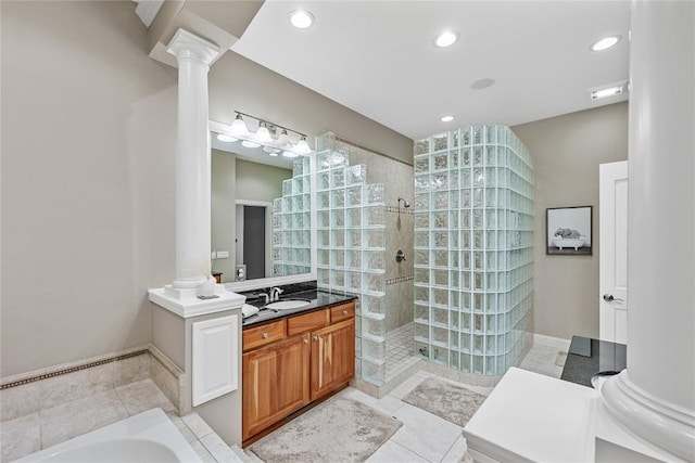 6712 Spring Grove Ct NE, Cedar Rapids, IA 52411 - bathroom with ornate columns, walk in shower, tile patterned flooring, vanity, and recessed lighting