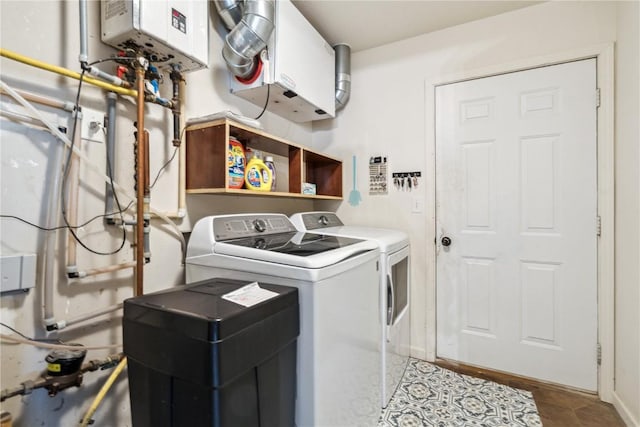 912 N St, Williamsburg, IA 52361 - washroom with independent washer and dryer, water heater, and tile patterned floors