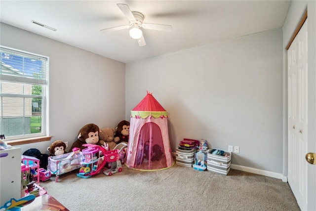 912 N St, Williamsburg, IA 52361 - playroom with carpet floors and a ceiling fan