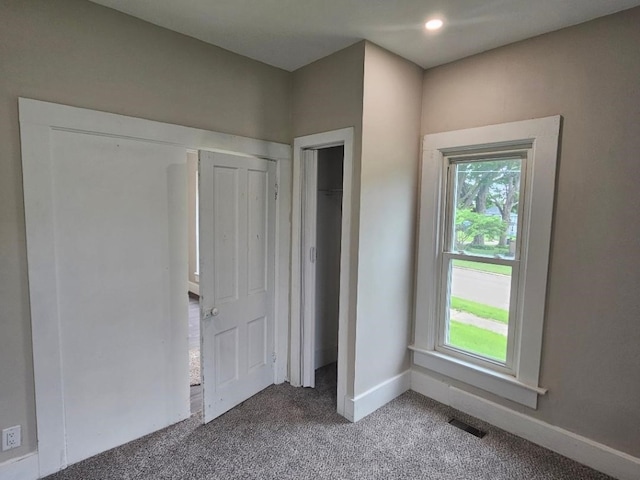 1602 11th Ave, Belle Plaine, IA 52298 - unfurnished bedroom featuring carpet, baseboards, and recessed lighting