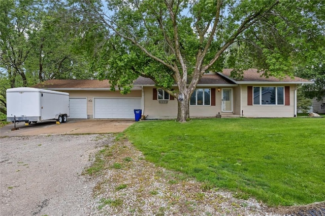2914 Windy Ridge Rd NE, Swisher, IA 52338 - ranch-style home featuring driveway, a front lawn, a garage, and entry steps