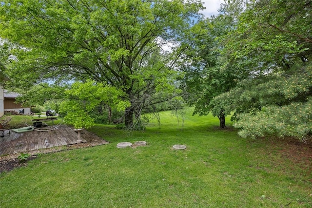 2914 Windy Ridge Rd NE, Swisher, IA 52338 - view of grassy yard featuring a wooden deck