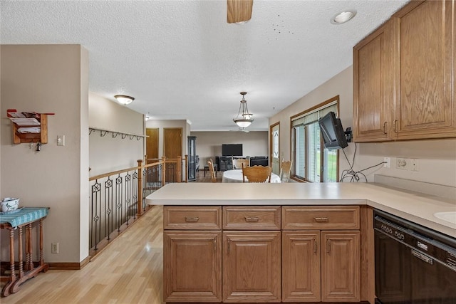 2914 Windy Ridge Rd NE, Swisher, IA 52338 - kitchen with dishwasher, a peninsula, light wood finished floors, light countertops, and brown cabinetry