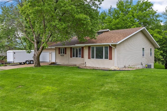 2914 Windy Ridge Rd NE, Swisher, IA 52338 - ranch-style home featuring cooling unit, a front yard, driveway, a garage, and roof with shingles