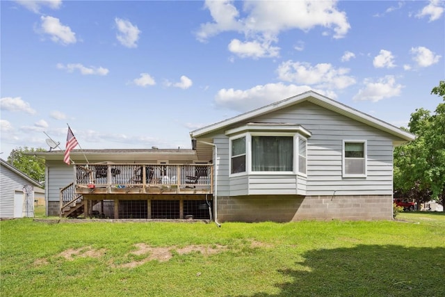 75 Jefferson Ave SW, Swisher, IA 52238 - back of house with a deck, a yard, and stairs
