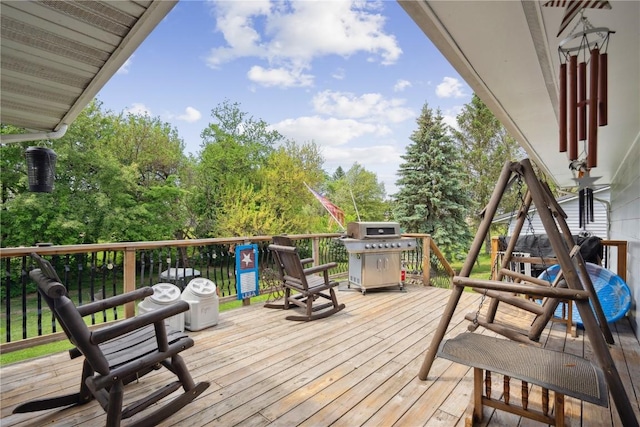 75 Jefferson Ave SW, Swisher, IA 52238 - wooden terrace featuring a grill