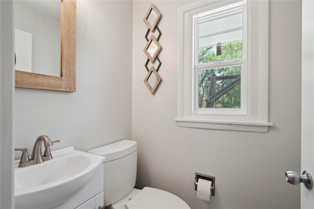 75 Jefferson Ave SW, Swisher, IA 52238 - half bathroom featuring toilet and vanity