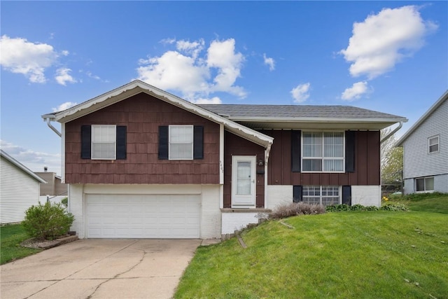 5407 Skyline Dr NW, Cedar Rapids, IA 52405 - bi-level home featuring a garage, brick siding, a front lawn, driveway, and board and batten siding