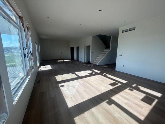 1205 Croell Ave, Tiffin, IA 52340 - unfurnished living room with wood finished floors and stairs