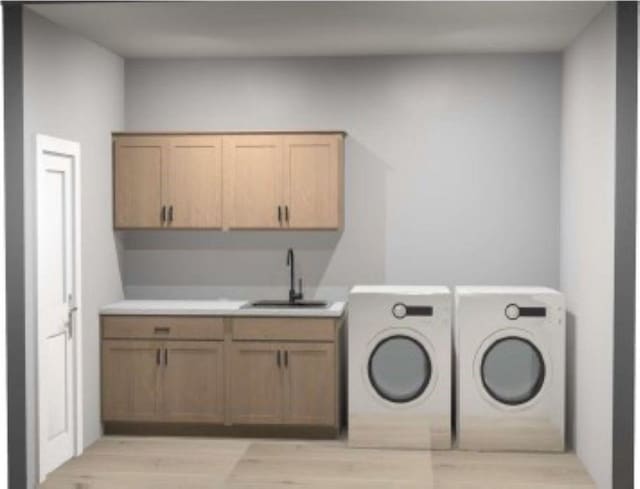 1205 Croell Ave, Tiffin, IA 52340 - laundry room featuring cabinet space, washing machine and clothes dryer, and light wood-style floors