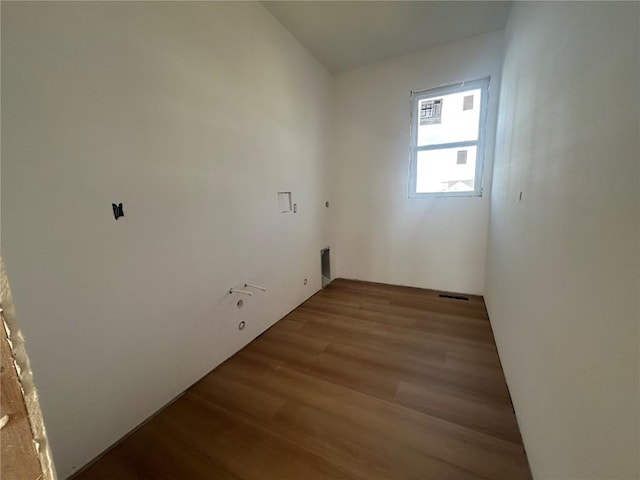 1205 Croell Ave, Tiffin, IA 52340 - laundry room featuring wood finished floors