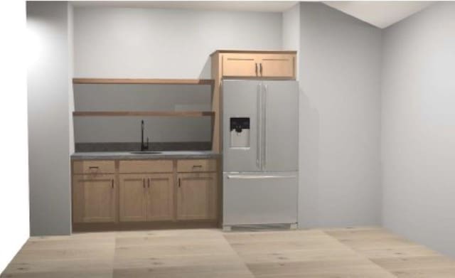 1205 Croell Ave, Tiffin, IA 52340 - kitchen with fridge with ice dispenser, a sink, light wood-type flooring, and dark countertops