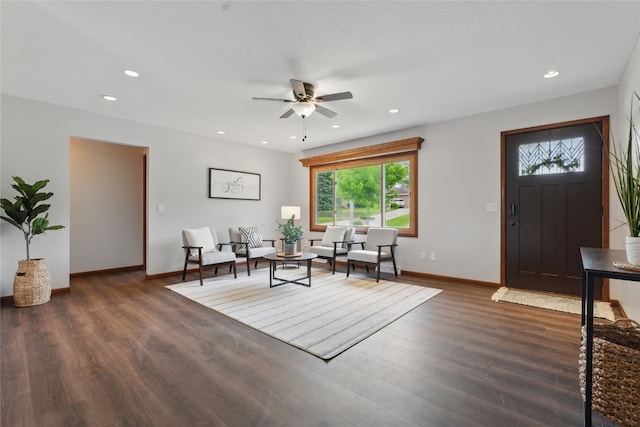 1206 W State St, Williamsburg, IA 52361 - living room featuring a ceiling fan, dark wood-style floors, recessed lighting, and baseboards