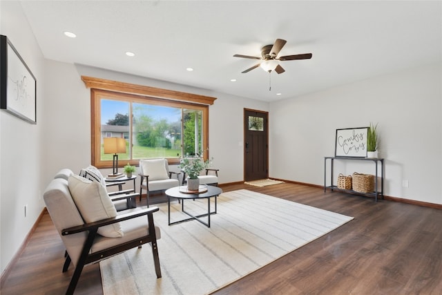 1206 W State St, Williamsburg, IA 52361 - living room featuring wood finished floors, a ceiling fan, baseboards, and recessed lighting