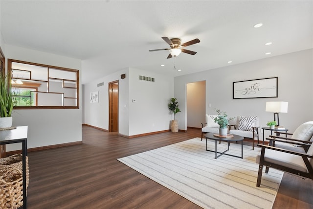 1206 W State St, Williamsburg, IA 52361 - living room featuring a ceiling fan, wood finished floors, baseboards, and recessed lighting