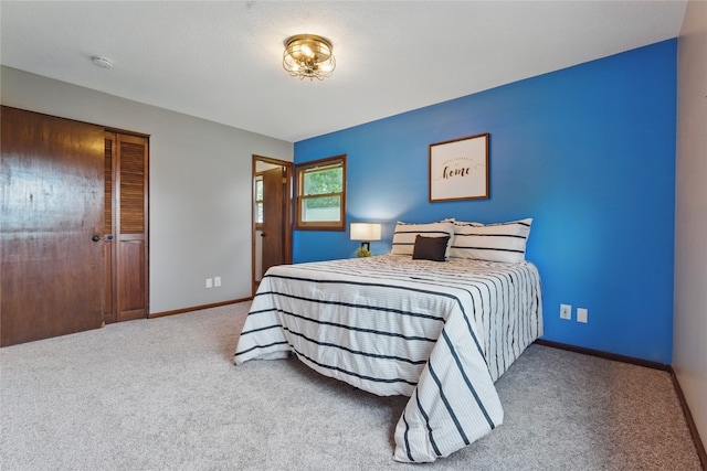 1206 W State St, Williamsburg, IA 52361 - carpeted bedroom with baseboards and a closet