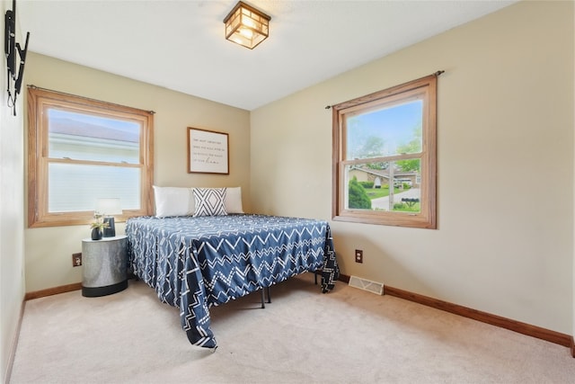 1206 W State St, Williamsburg, IA 52361 - carpeted bedroom featuring baseboards