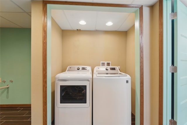1206 W State St, Williamsburg, IA 52361 - washroom with washing machine and clothes dryer, dark wood-type flooring, and baseboards