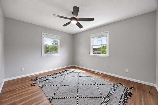 1220 Northwood Ln, Muscatine, IA 52761 - empty room with baseboards, a ceiling fan, and wood finished floors