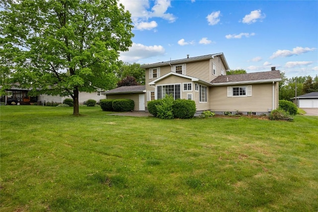 1220 Northwood Ln, Muscatine, IA 52761 - back of property featuring a lawn