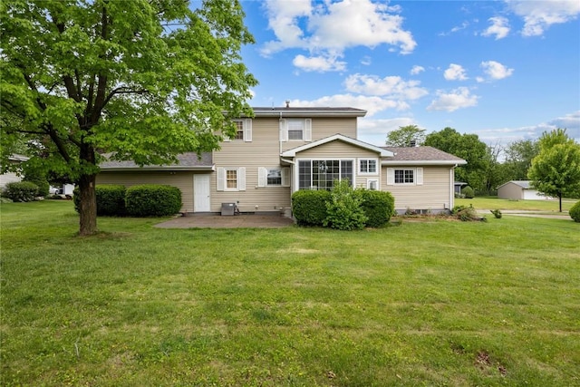 1220 Northwood Ln, Muscatine, IA 52761 - back of house with a patio area and a lawn