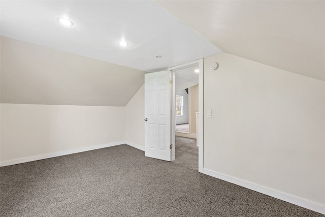 1298 14th Ave, Marion, IA 52302 - bonus room with dark carpet, lofted ceiling, baseboards, and recessed lighting