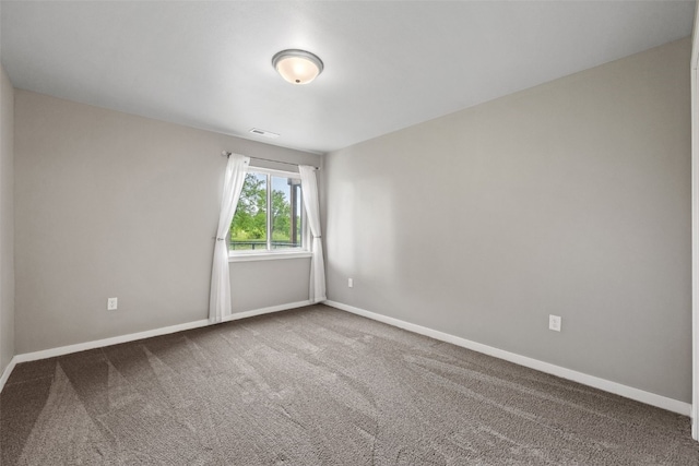 1225 Daisy Cir, North Liberty, IA 52317 - carpeted empty room with baseboards