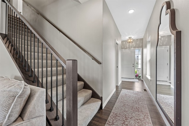 1225 Daisy Cir, North Liberty, IA 52317 - foyer featuring dark wood-style flooring, stairs, and baseboards