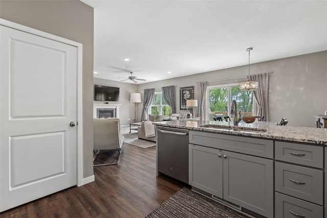 1225 Daisy Cir, North Liberty, IA 52317 - kitchen featuring dishwasher, gray cabinetry, a sink, dark wood-style flooring, and ceiling fan
