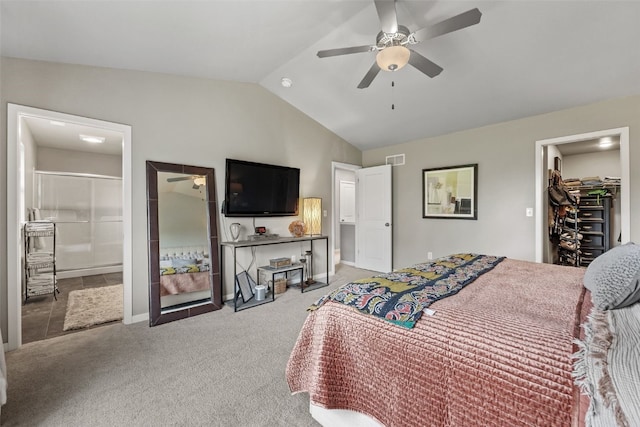 1225 Daisy Cir, North Liberty, IA 52317 - carpeted bedroom featuring vaulted ceiling, a spacious closet, a ceiling fan, connected bathroom, and baseboards