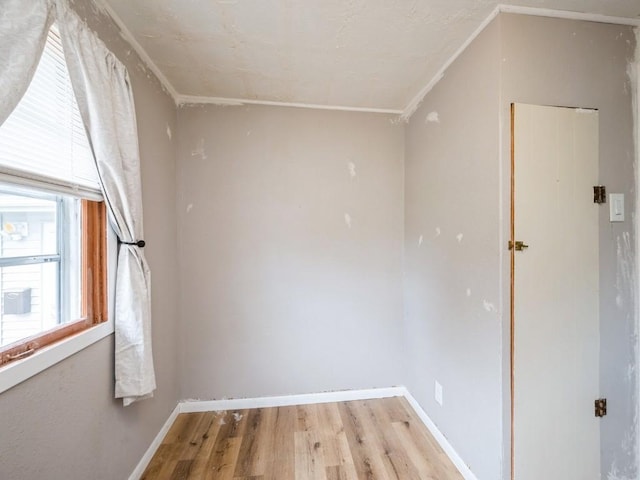 259 25th Ave SW, Cedar Rapids, IA 52404 - spare room featuring light wood-type flooring, ornamental molding, and baseboards