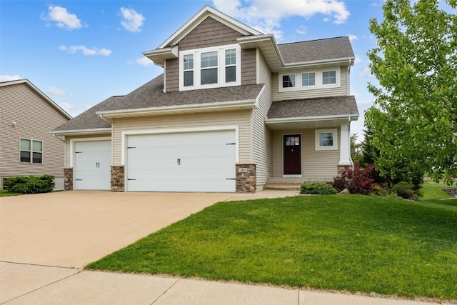 2913 Caspian Rd, Hiawatha, IA 52233 - craftsman-style home featuring a front yard, concrete driveway, stone siding, and a shingled roof