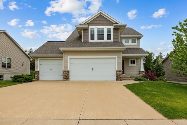 2913 Caspian Rd, Hiawatha, IA 52233 - craftsman-style house featuring stone siding, a front yard, driveway, and a shingled roof